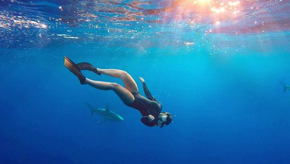 Kelly diving with sharks