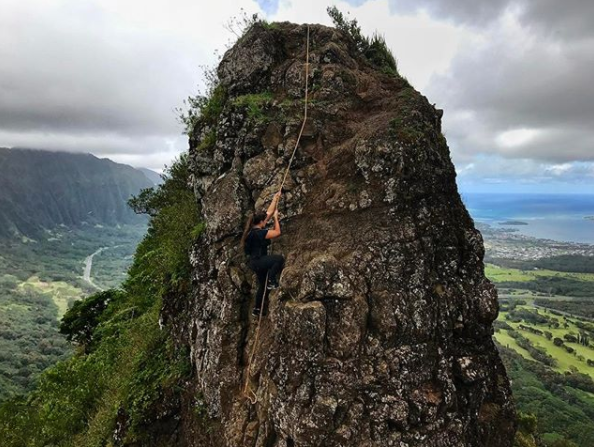 Kelly climbing a mountain